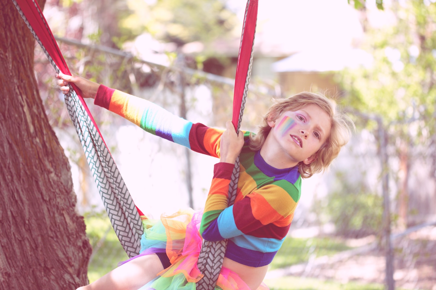 Bink, a gender non-conforming 10 year old child playing outside.