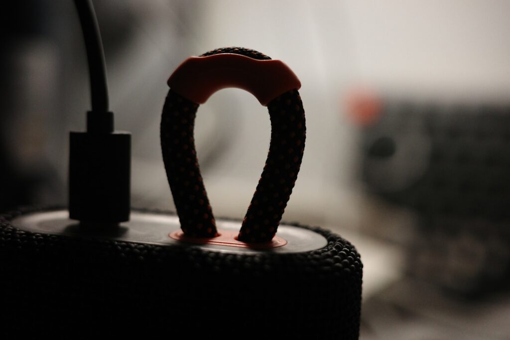 a black object with a red ring on top of it